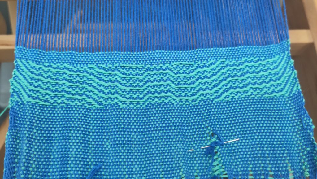 First test of the warp, showing a pin holding in two threads that I had to swap over.