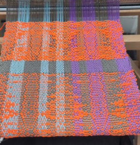 Funky flouro-orange pattern, looks a bit like two moths side by side.